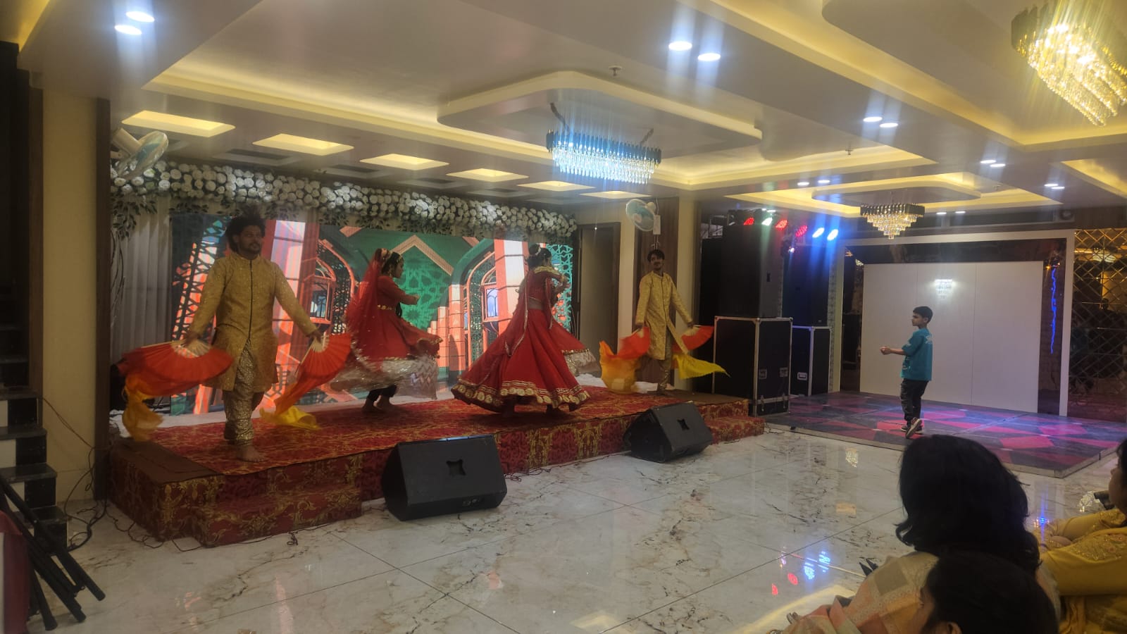 Reception evening set-up with stage and seating at Hotel Veda Inn